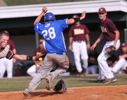 Bryant's Drew Tipton (28) tries to avoid the tag of Lake Hamilton catcher Carter Greathouse, left. (Photo by Kevin Nagle)