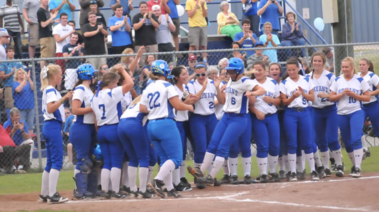 Peyton Jenkins is greeted at home plate after her third-inning grand slam. (Photo by Kevin Nagle)