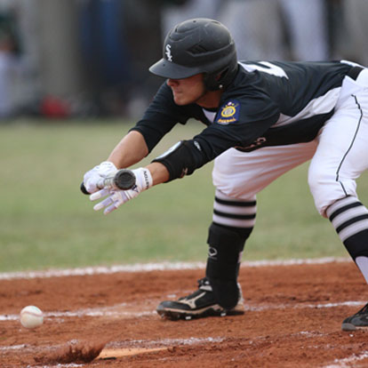 Tyler Nelson executes a squeeze bunt. (photo by Rick Nation)