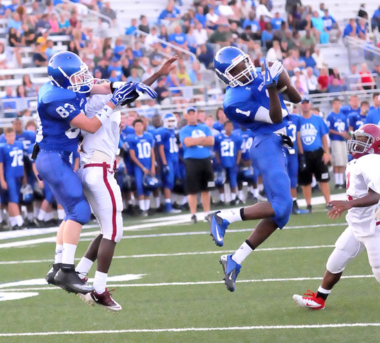 Quinton Royal (1) hauls in a touchdown pass in front of teammate Liam Miller (83) and a Pine Bluff defender. (Photo by Kevin Nagle)