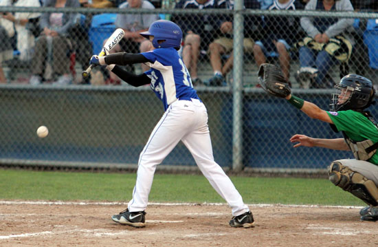 Logan Allen gets a squeeze bunt down to drive in what proved to be the winning run. (Photo by Teresa Smith, Northwest Sports Photography)