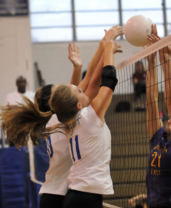 Hannah Rice and Alyssa Anderson play at the net. (Photo by Kevin Nagle)