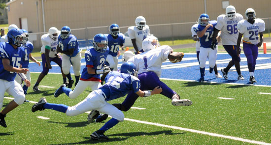 Collin Welch (15) hauls down Dunbar quarterback Dalivion Childs on a two-point conversion run. On the way to help were Sam Harrison (3), Josh Bonner (75), D.J. Buckner (73), Caylin Allen (10) and London Taylor (74). (Photo by Kevin Nagle)