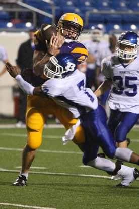 Catholic tight end Jack Tiapek (85) was unable to hang onto this pass after being hit by Bryant's Aaron Bell (7). (Photo by Rick Nation)