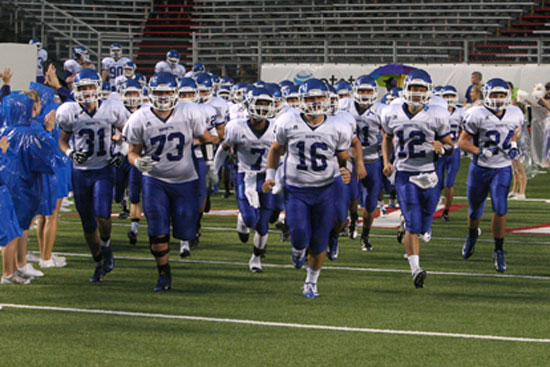 The Hornets take the field. (Photo by Rick Nation)