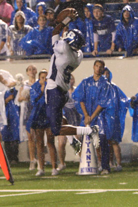 K.J. Hill goes high to make a clutch fourth-down catch to set up the decisive score for the Bryant Hornets Friday night. (Photo by Rick Nation)