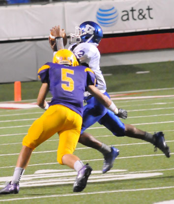 Bryant's Brushawn Hunter (2) catches a pass in front of Cathllic's Jake Harris (5). (Photo by Kevin Nagle)