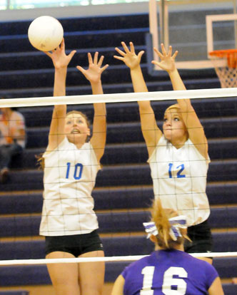 Alyssa Anderson (10) and McKenzie Rice (12) go up for a block. (Photo by Kevin Nagle)