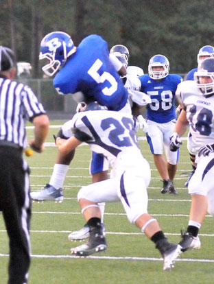 K.J. Hill hauls in a pass as he's hit by Conway's Colin Condit. (Photo by Kevin Nagle)