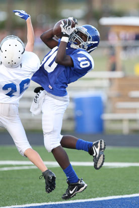 Caylin Allen (10) hauls in a touchdown pass over Lakewood's Blake Keane. (Photo by Rick Nation)