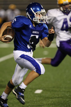 Gunnar Burks breaks into the open field. (Photo by Rick Nation)