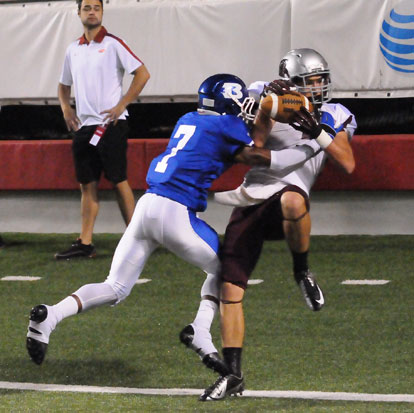 Bryant's Aaron Bell (7) shoves Benton's Boone Cox out of the back of the end zone but Cox got a foot down for the touchdown. (Photo by Kevin Nagle)