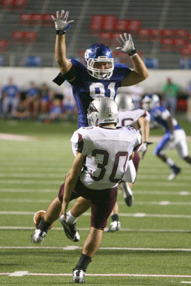 Tim Kelly (91) blocks the punt of Benton's Shaun Carrey. (Photo by Rick Nation)