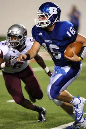 Bryant quarterback Hayden Lessenberry threw for four touchdowns and here runs past Benton's Savonte Wallace. (Photo by Rick Nation)