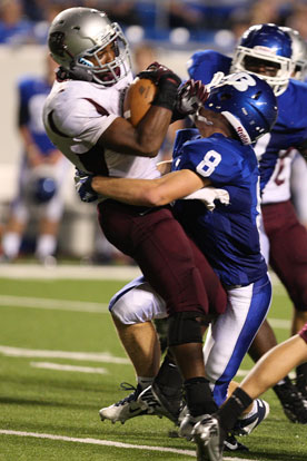 Davis Nossaman (8) makes an open-field stop. (Photo by Rick Nation)