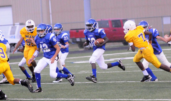 Caylin Allen (10) returned the opening kickoff for a touchdown against Little Rock Horace Mann. Here, he's escorted by Dillon Medlock (42), Jeffery Hastings (25) and Sam Harrison (3). (Photo by Kevin Nagle)