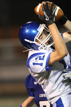 Evan Lee (12) makes an interception in front of Conway's Stephen Peters. (Photo by Rick Nation)