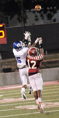 Bryant's K.J. Hill (5) tries to leap over Pine Bluff's Rakeem Leverett (12) on a deep pass down the sideline. (Photo by Kevin Nagle)