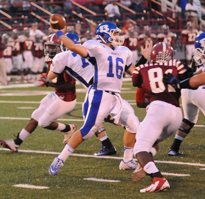 Hayden Lessenberry steps into a throw as Pine Bluff's Cameron Jackson (81) applies pressure. (Photo by Kevin Nagle)