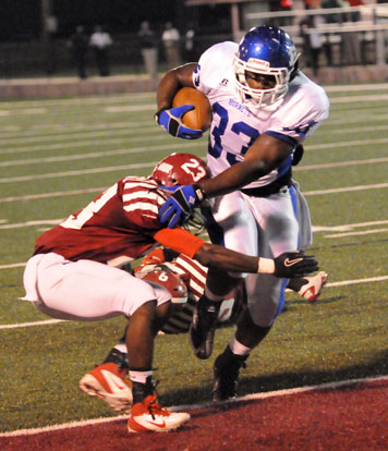 Tyree Reese (33) bowls into the end zone over Pine Bluff's Deandre Gridley for Bryant's first touchdown. (Photo by Kevin Nagle)