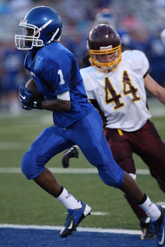 Bryant's Quinton Royal (1) steps past Lake Hamilton's Eli Jackson (44) into the end zone. (Photo by Rick Nation)