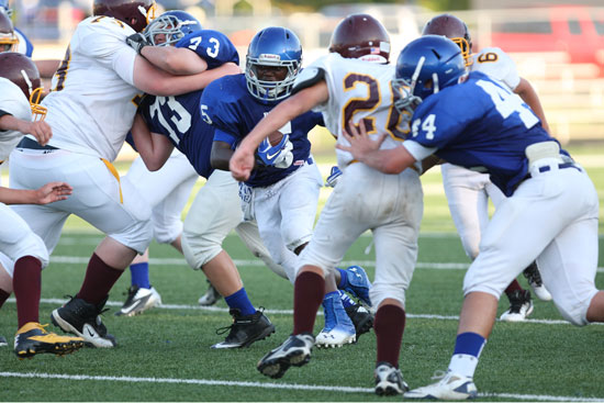 De'Amonte Terry cuts upfield off blocks by Noah Easterling (73) and Hayden Knowles (44). (Photo by Rick Nation)