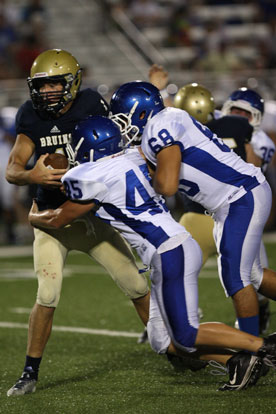 Tanner Rich and Amador Gaspar sack Pulaski Academy quarterback Will Hefley. (Photo by Rick Nation)