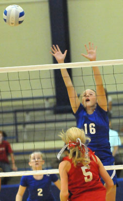 Bryant White's Gabbie Bonvillain (16) makes a play at the net while teammate Maddie Miller (2) backs her up. (Photo by Kevin Nagle)