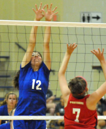 Erin Chappell (12) tries to block a Cabot North hit during Bryant White's match Monday night. (Photo by Kevin Nagle)