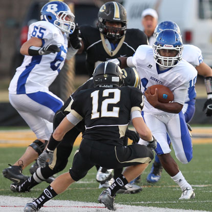 Devonte Howard (10) takes on Central safety Nick Hayes off a lead block from Jacob Ward (65). (Photo by Rick Nation)