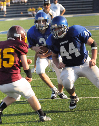 Travis Bradberry runs interference for teammate Grant Botti. (Photo by Kevin Nagle)