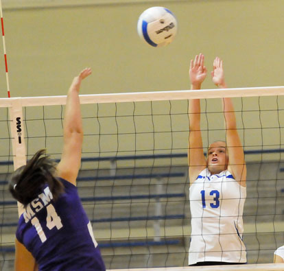 Bryant's Sarah Kennedy (13) goes for a block. (Photo by Kevin Nagle)