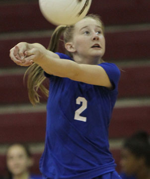 Maddie Miller returns the ball for Bryant White. (Photo by Rick Nation)