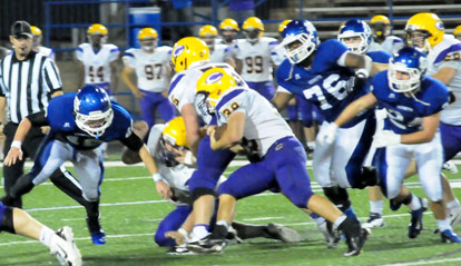 A Bryant defender draws a bead on Catholic running back Joe Mariani (39) as Cameron Murray (76) and Bryce Denker (24) pursue. (Photo by Kevin Nagle)