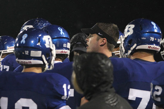 Bryant offensive coordinator Lance Parker instructs the Hornets during a timeout. (Photo by Rick Nation)