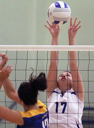 Bryant's Alex Dillard (17) reaches for a block. (Photo by Rick Nation)