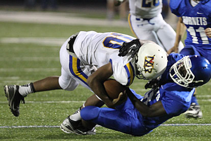 Bryant's Caylin Allen wrestles down North Little Rock's Antonio Reed. (Photo by Rick Nation)