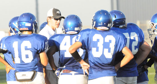 Bryant White head coach Brad Smothermon instructs his players during a timeout. (Photo by Kevin Nagle)