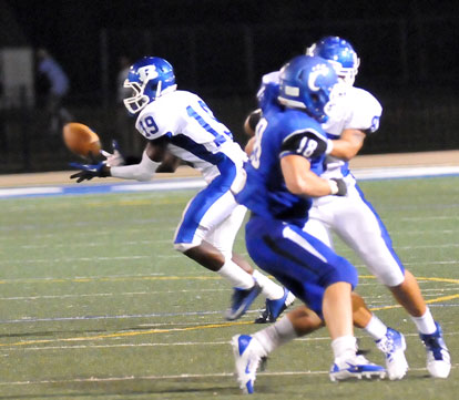 Kylon Boyle (19) looks in a pass as Dalton Griesemer leads his interference. (Photo by Kevin Nagle)