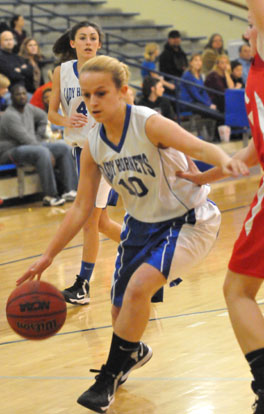 Lauren Lessenberry tries to drive as teammate Hadley Dickinson (4) follows the action. (Photo by Kevin Nagle)