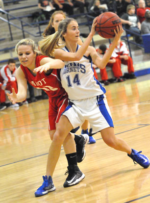 Anna Lowery (14) tries to keep control of the ball against Cabot North's Maddie Rice. (Photo by Kevin Nagle)