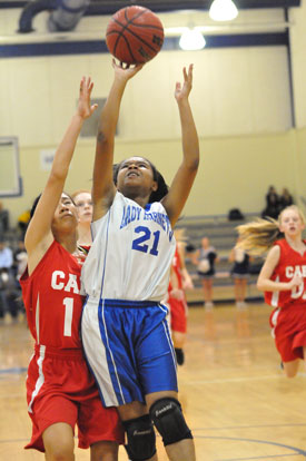 Destiny Martin (21) pulls up for a jumper. (Photo by Kevin Nagle)