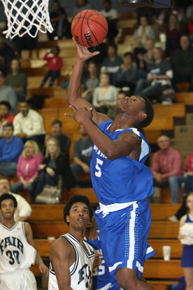 K.J. Hill overcame early foul trouble to score 18 points to lead the Hornets. (Photo by Rick Nation)