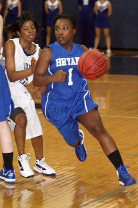 Destin Nichols (1) drives around a J.A. Fair defender. (Photo by Rick Nation)