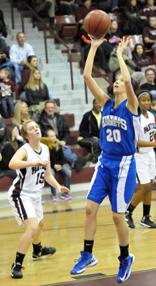 Kailey Nagle (20) shoots a short jumper in front of Benton's Abby Clay. (Photo by Kevin Nagle)