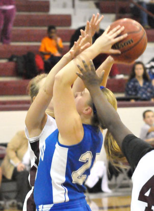 Anna Turpin fights through a double team to shoot. (Photo by Kevin Nagle)