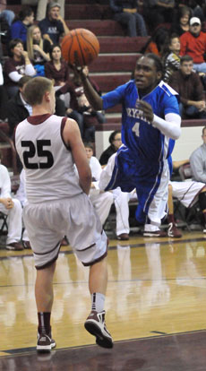 Bryant's Simeon Watson (4) tries to avoid Benton's Westin Riddick on a drive to the hoop. (Photo by Kevin Nagle)