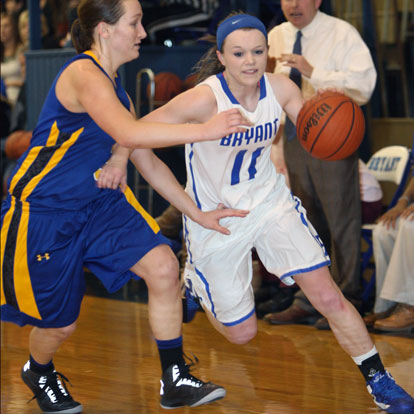 Logan Davis (11) tries to drive around Sheridan's Josey Love. (Photo by Rick Nation)