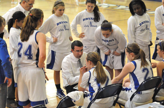 Lady Hornets coach Nathan Castaldi instructs his team during a timeout. (Photo by Kevin Nagle)