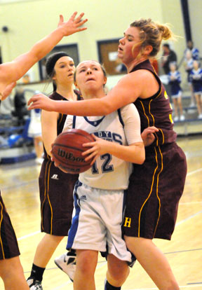 Skylar Davis is fouled as she drives into the heart of the Lake Hamilton defense. (Photo by Kevin Nagle)